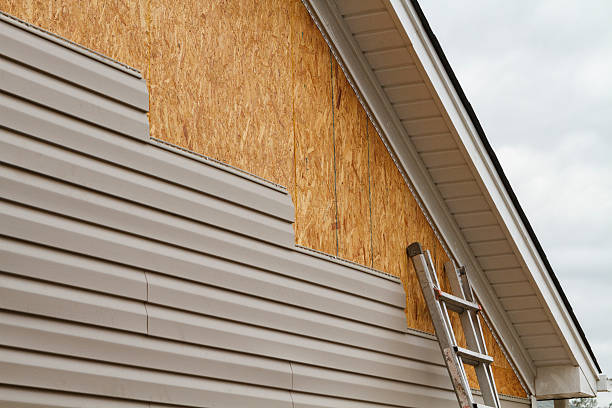 Professional Siding Replacement technician working in Brightwaters, NY